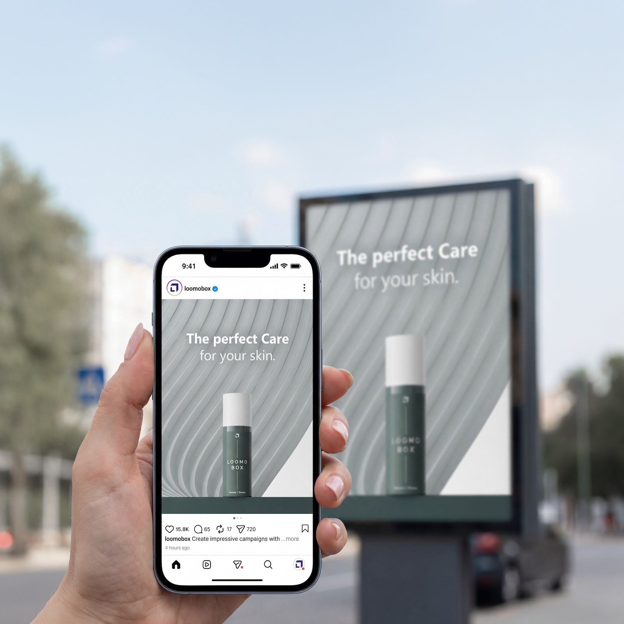 Hand holding a smartphone with a loomobox skincare Instagram ad, the same campaign visual on a billboard behind